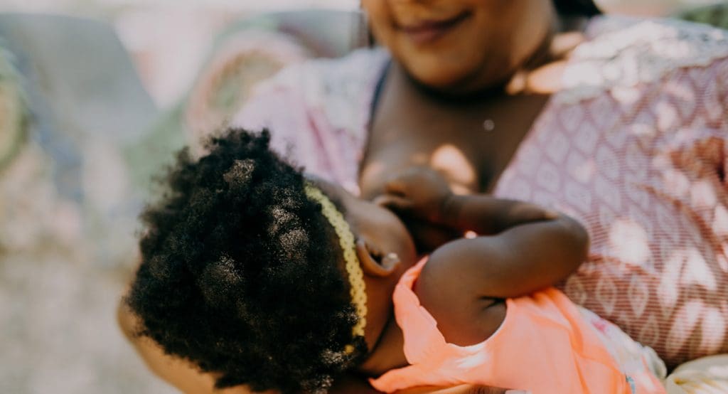 Breastfeeding mother and daughter